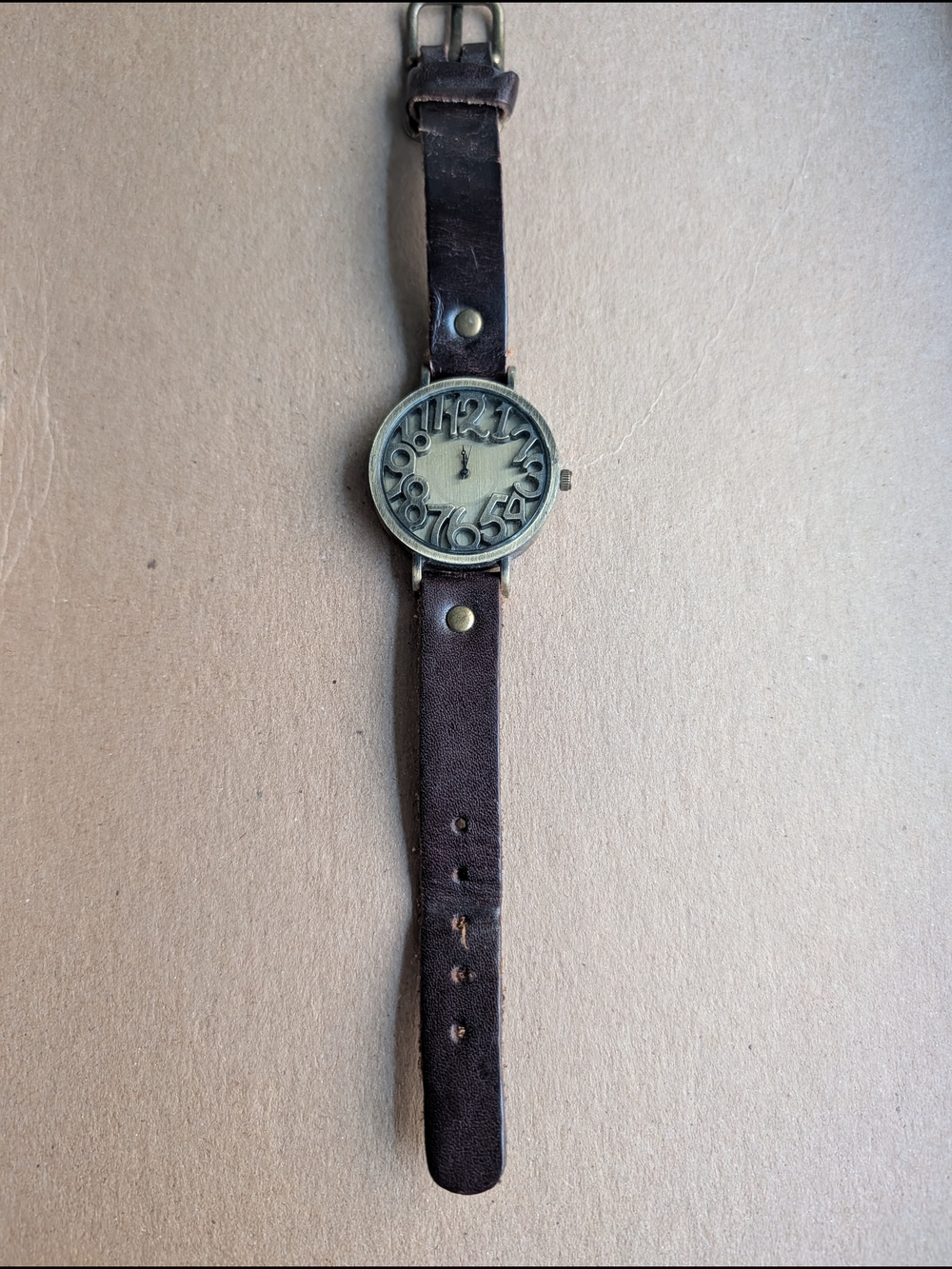 Vintage retro watch with  raised oversized numbers that curve around the dial.